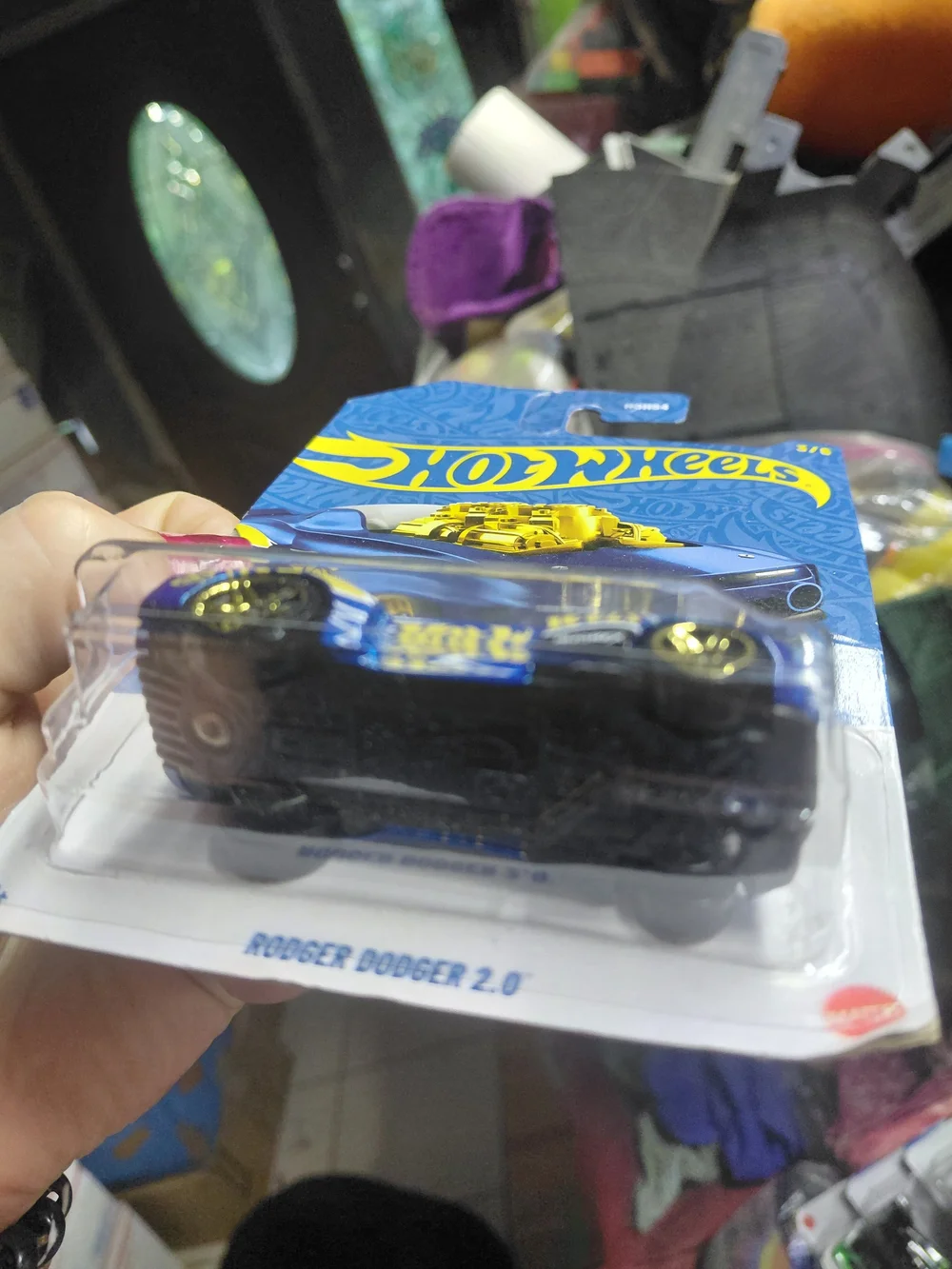 the Hot Wheels Rodger Dodger 2.0 from the 2026 58th Anniversary Blue and Gold se